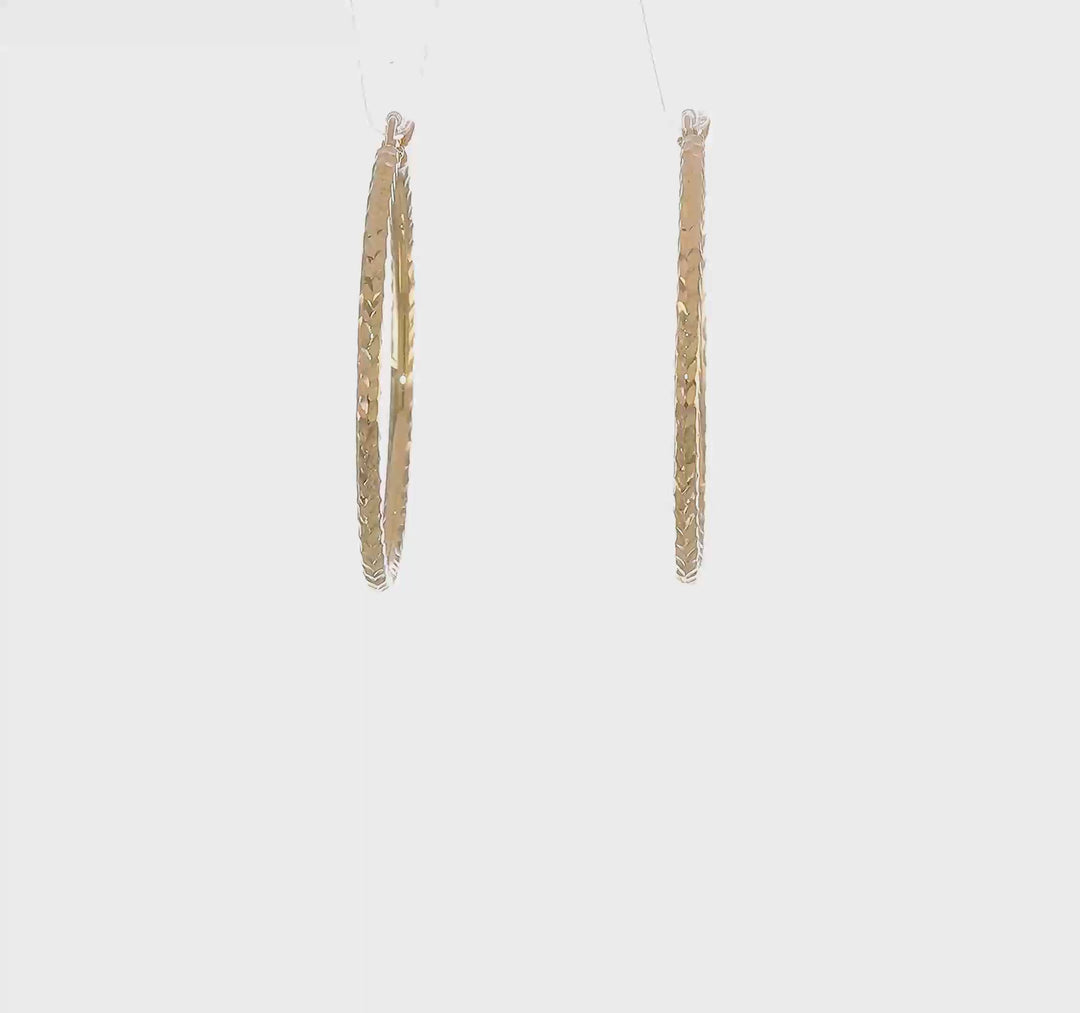 Pendientes de Aro Tubo Redondo de Oro Amarillo de 10K con Corte Diamante de 2 mm